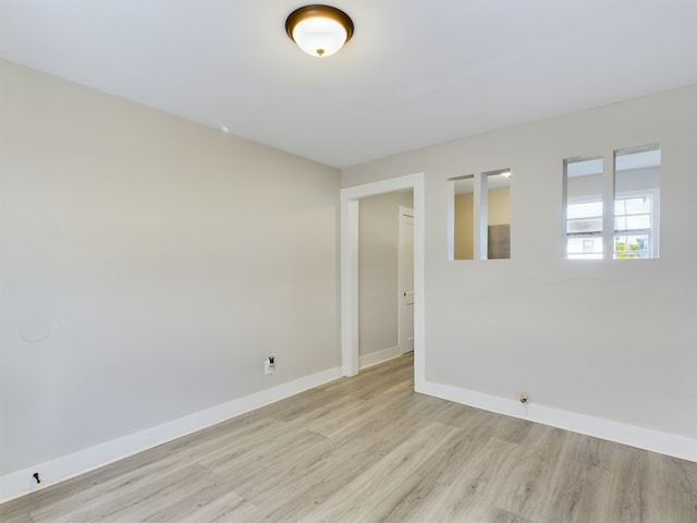 spare room featuring light hardwood / wood-style flooring