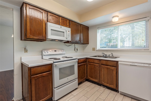 kitchen with sink and white appliances