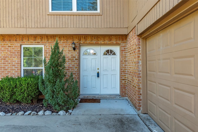 property entrance with a garage