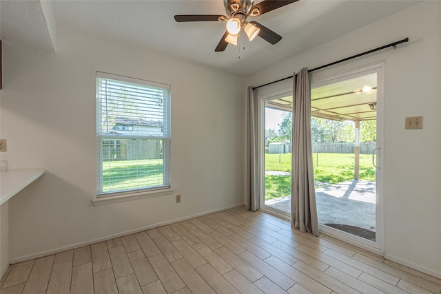 interior space with ceiling fan and light hardwood / wood-style floors