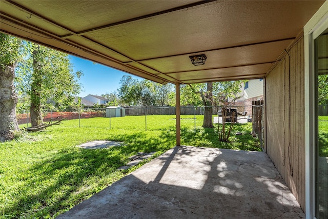 view of patio featuring a storage shed