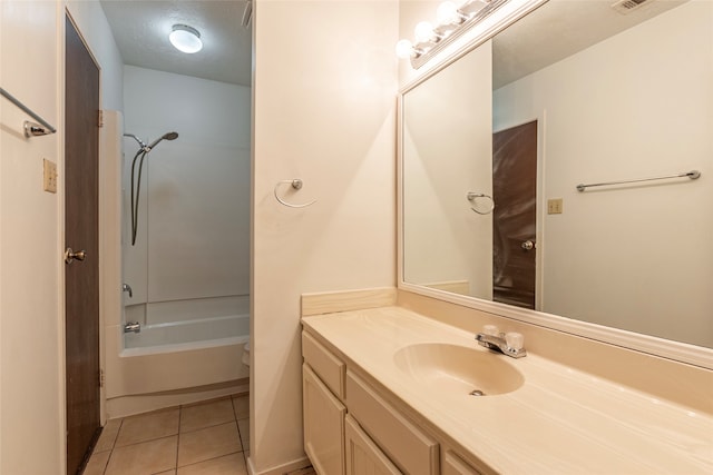 full bathroom with shower / bath combination, tile patterned floors, vanity, a textured ceiling, and toilet