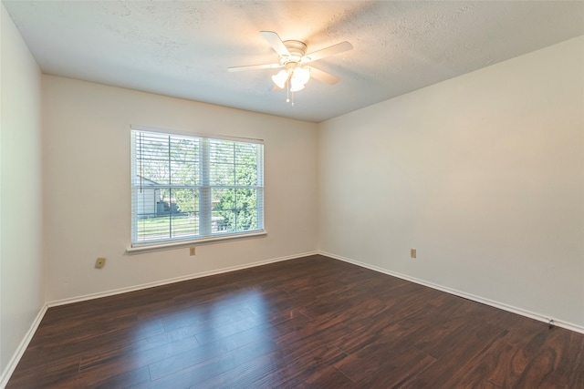 unfurnished room featuring a textured ceiling, ceiling fan, and dark hardwood / wood-style floors