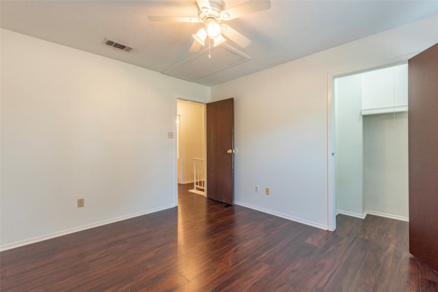 unfurnished bedroom featuring ceiling fan, a closet, and dark hardwood / wood-style floors