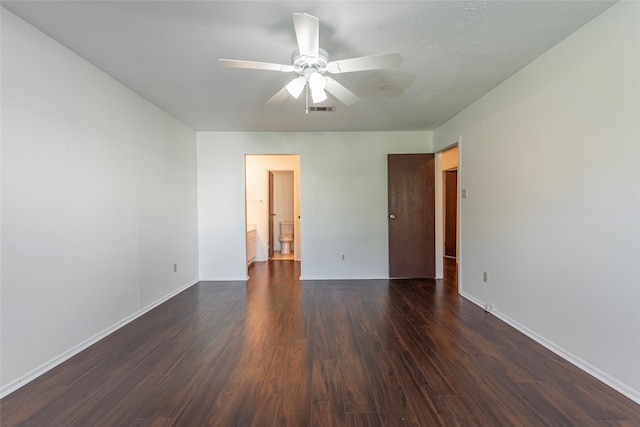 unfurnished room featuring dark hardwood / wood-style floors and ceiling fan