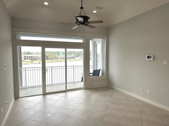 interior space featuring ceiling fan and light tile patterned floors