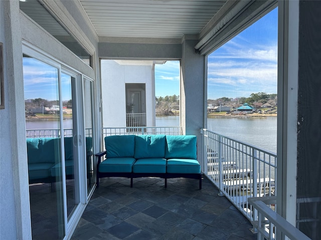 balcony featuring a water view