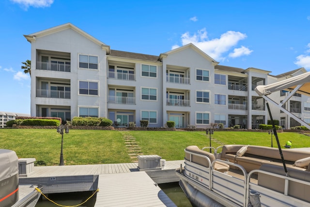 dock area featuring a lawn