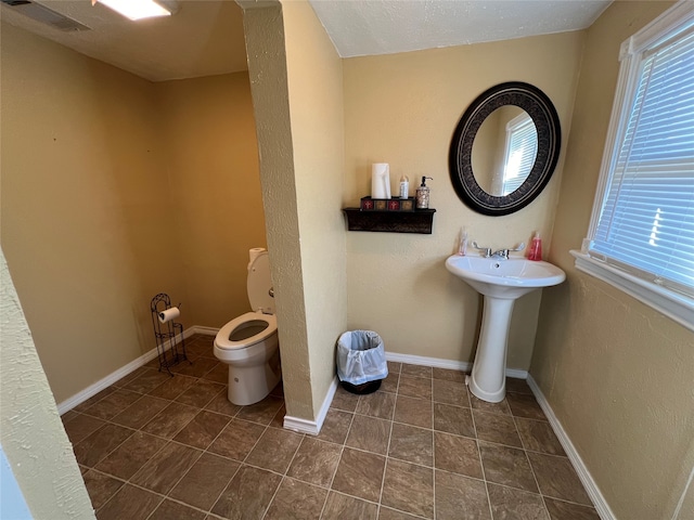 bathroom featuring toilet