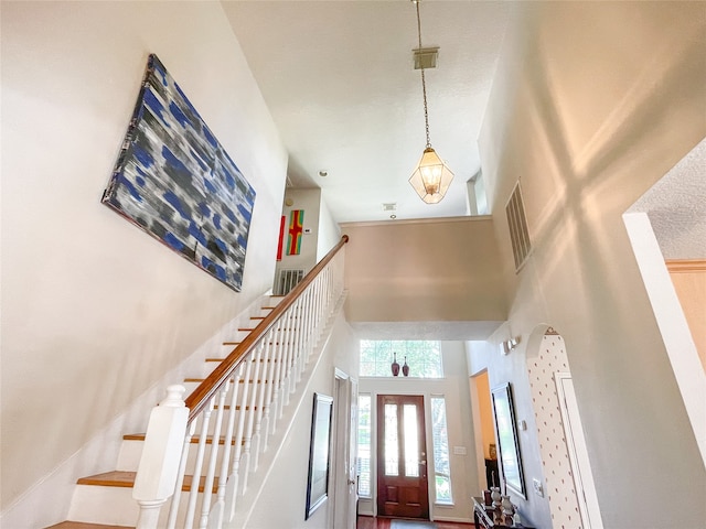 foyer featuring a high ceiling