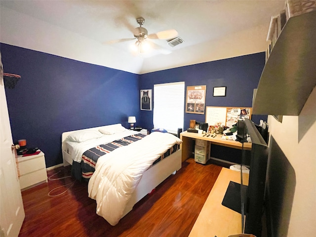 bedroom featuring ceiling fan and dark hardwood / wood-style flooring