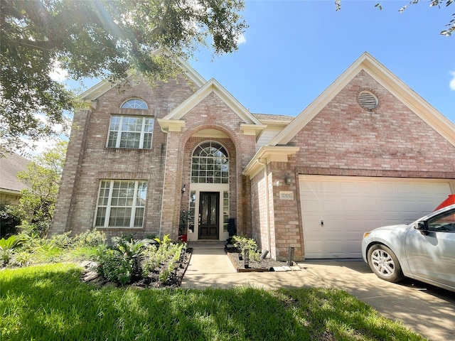 front of property with a garage and french doors