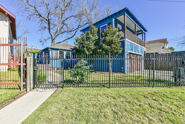 view of property exterior featuring a yard, a balcony, and a garage