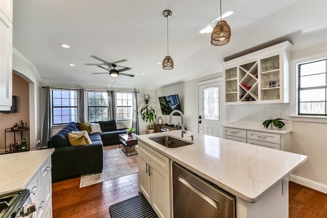 kitchen featuring white cabinetry, sink, dark hardwood / wood-style floors, an island with sink, and appliances with stainless steel finishes