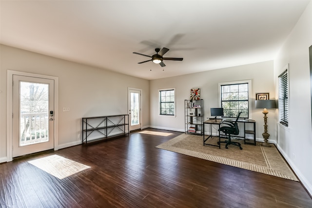 unfurnished office featuring dark hardwood / wood-style flooring and ceiling fan