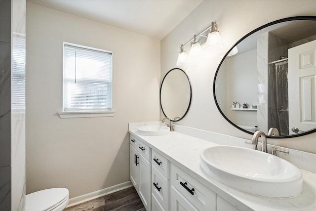 bathroom featuring hardwood / wood-style floors, vanity, toilet, and a shower with shower curtain