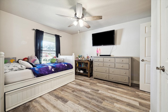 bedroom with ceiling fan and light wood-type flooring