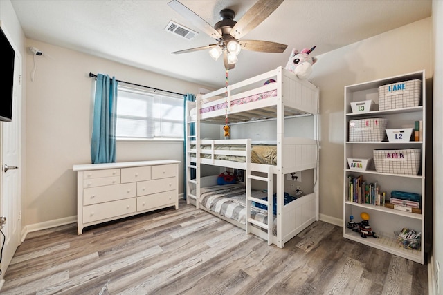 bedroom featuring hardwood / wood-style floors and ceiling fan