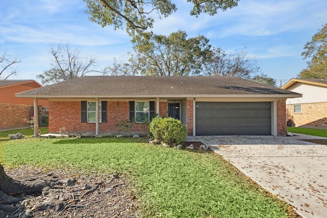 ranch-style home featuring a garage and a front lawn