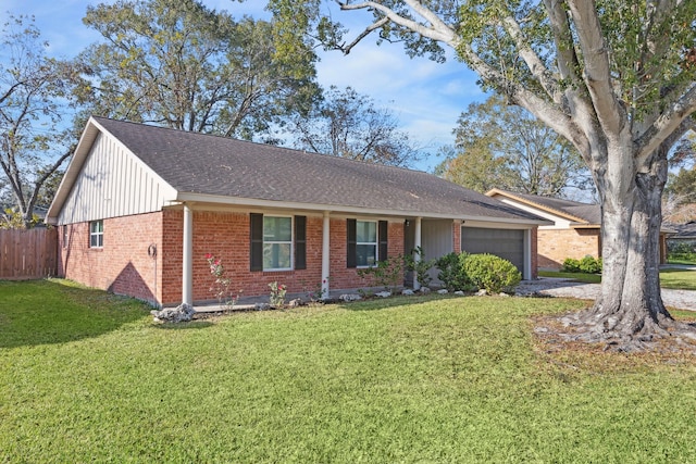 ranch-style house featuring a front lawn and a garage