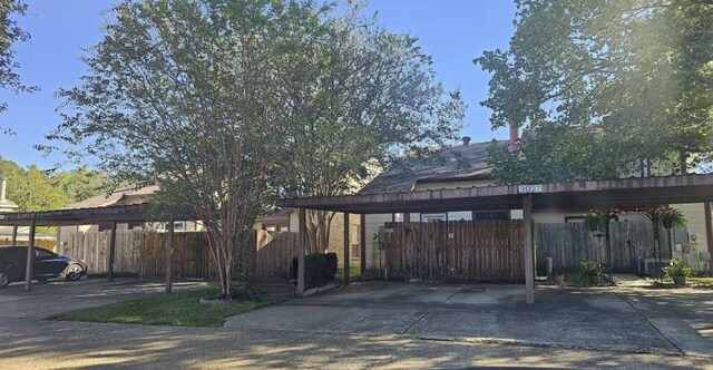 exterior space with a carport