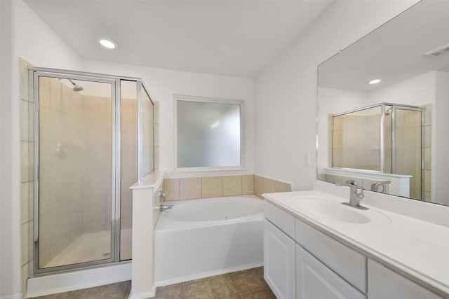 bathroom with plus walk in shower, vanity, and tile patterned floors