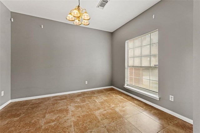 empty room with an inviting chandelier and plenty of natural light