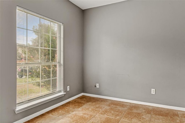 empty room featuring light tile patterned floors