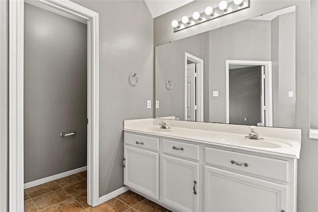 bathroom featuring tile patterned flooring and vanity