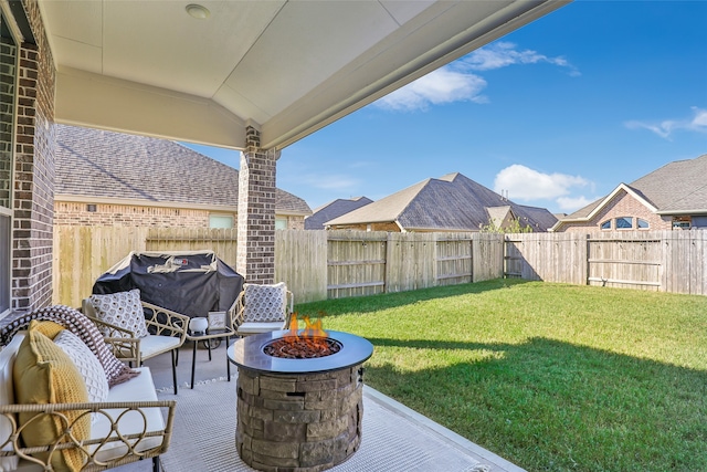 view of yard with a patio area and an outdoor fire pit