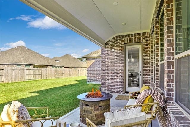 view of patio featuring an outdoor fire pit