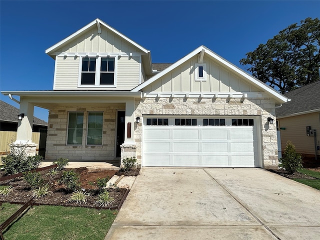 view of front of house featuring a porch and a garage