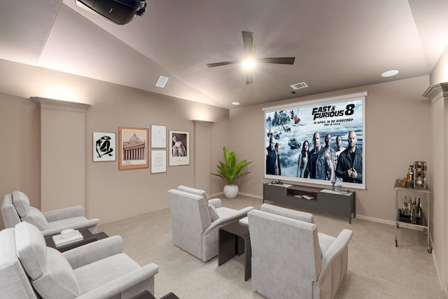 cinema room with light colored carpet, vaulted ceiling, and ceiling fan