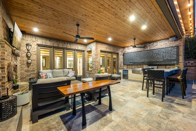 view of patio / terrace featuring outdoor lounge area, ceiling fan, and an outdoor kitchen