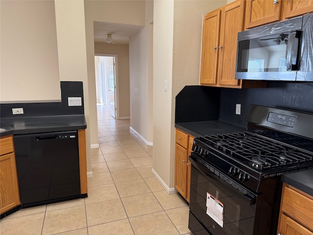 kitchen featuring light tile patterned floors, tasteful backsplash, and black appliances