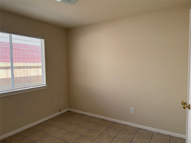 spare room featuring light tile patterned floors