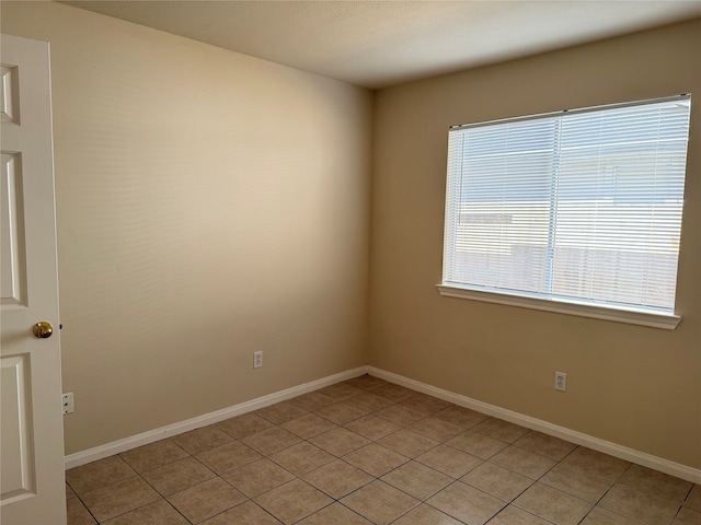 view of tiled spare room