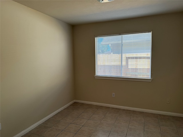 spare room with light tile patterned flooring