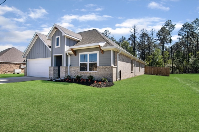 view of front facade featuring a front yard and a garage