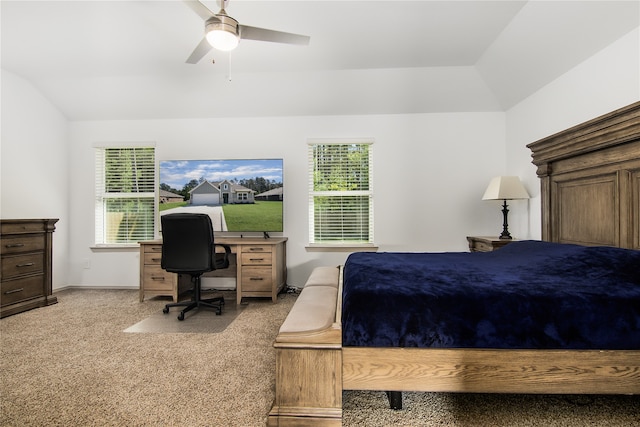 bedroom with multiple windows, light colored carpet, vaulted ceiling, and ceiling fan