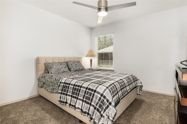 bedroom featuring dark colored carpet and ceiling fan