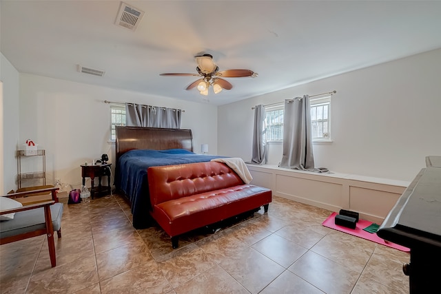 bedroom featuring ceiling fan and light tile patterned floors