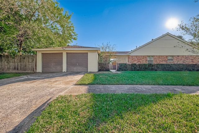 single story home with a garage and a front yard