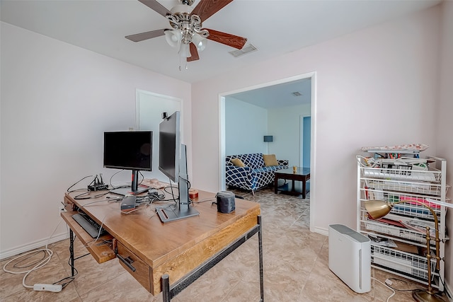 home office with light tile patterned floors and ceiling fan