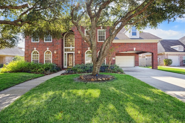 view of front facade with a garage and a front yard