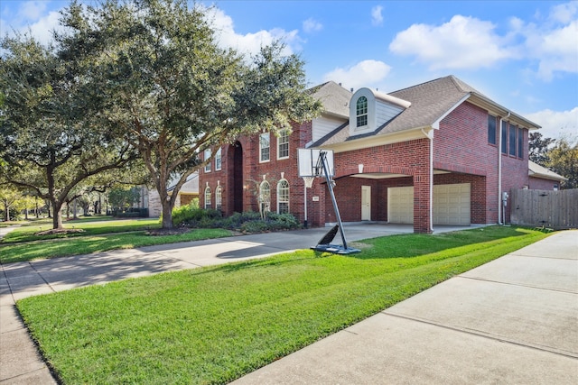 view of front facade with a garage and a front yard