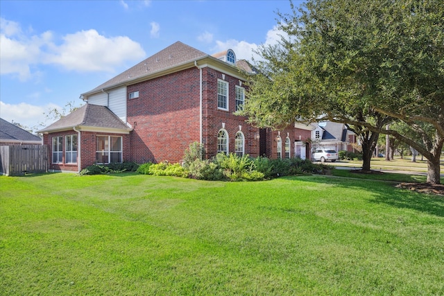 view of property exterior with a yard