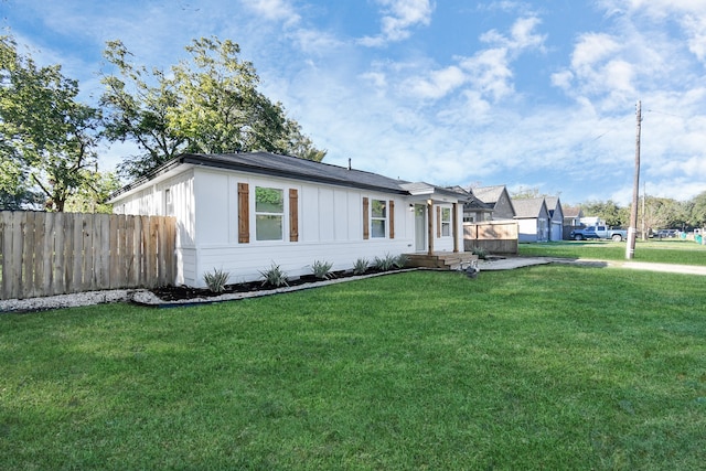 ranch-style house with a front lawn