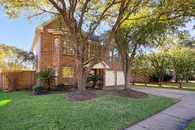 view of front property featuring a garage and a front lawn