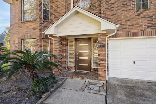 view of exterior entry featuring a garage